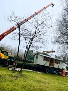 ac45 mobile crane lifting a shepherds hut