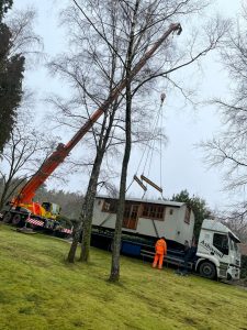 ac45 mobile crane lifting a shepherds hut