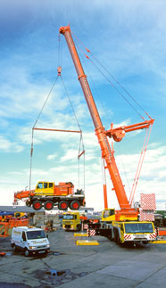 Heavy Duty Crane lifting a City Crane