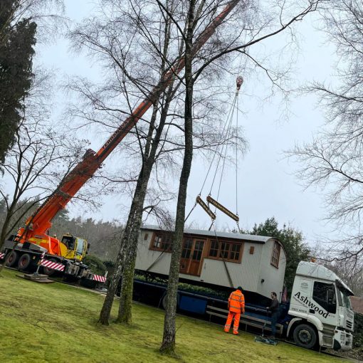 ac45 mobile crane lifting a shepherds hut