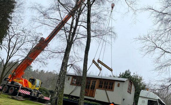 ac45 mobile crane lifting a shepherds hut